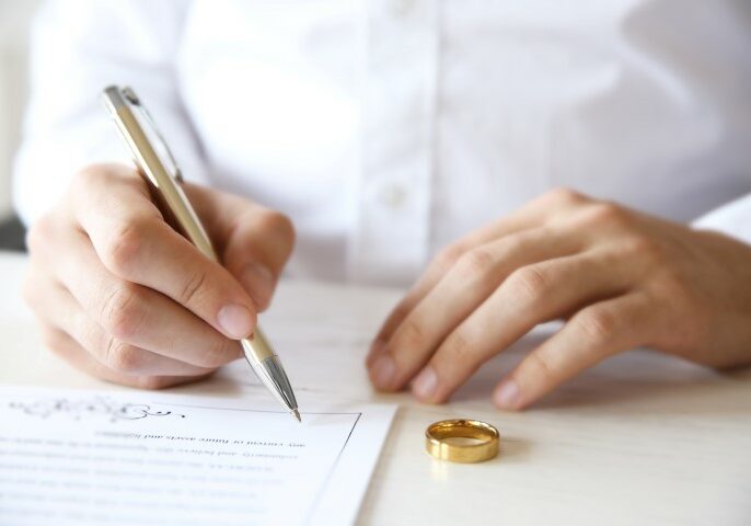 Man signing a prenuptial agreement before getting married